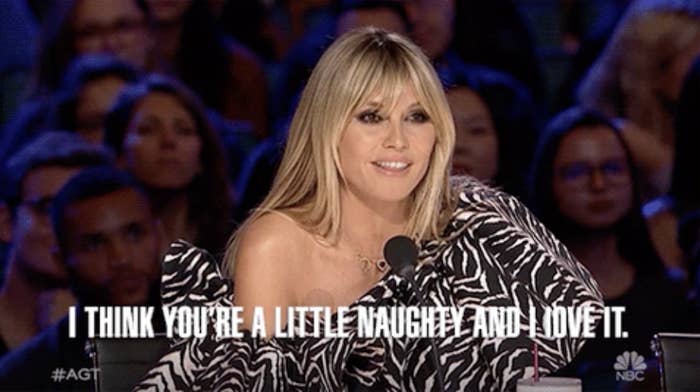 Heidi Klum in a zebra-stripe top smiling at AGT with caption &quot;I think you&#x27;re a little naughty and I love it.&quot;