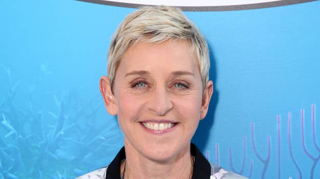 Ellen DeGeneres smiling at a promotional event, wearing a smart-casual blazer and shirt