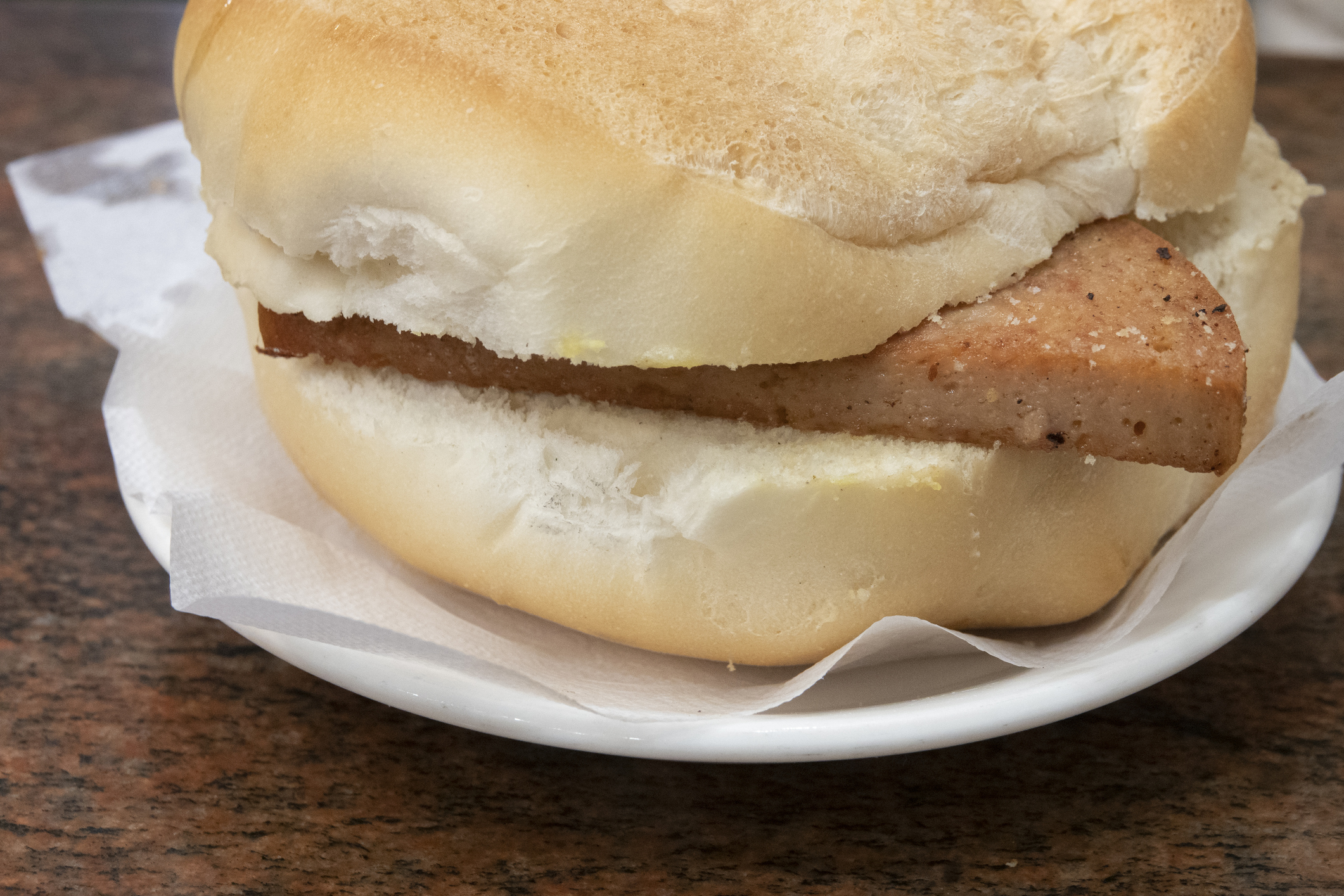 Sausage sandwich on a white plate