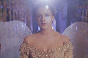 Claire Danes as Juliet in ornate angel costume with wings in "Romeo + Juliet" movie