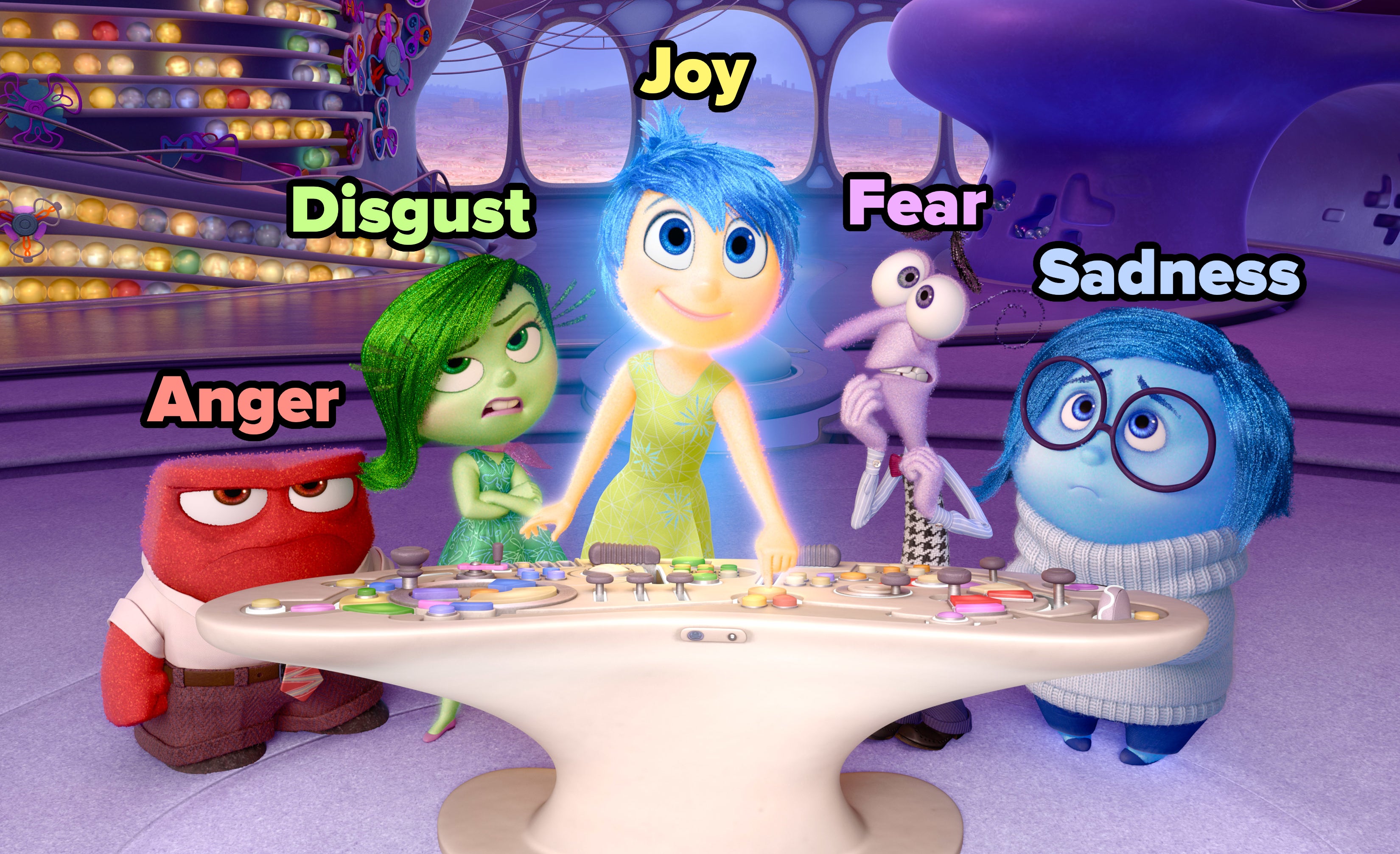 Animated characters from &#x27;Inside Out&#x27; with Joy, Anger, Disgust, Fear, and Sadness around a control console