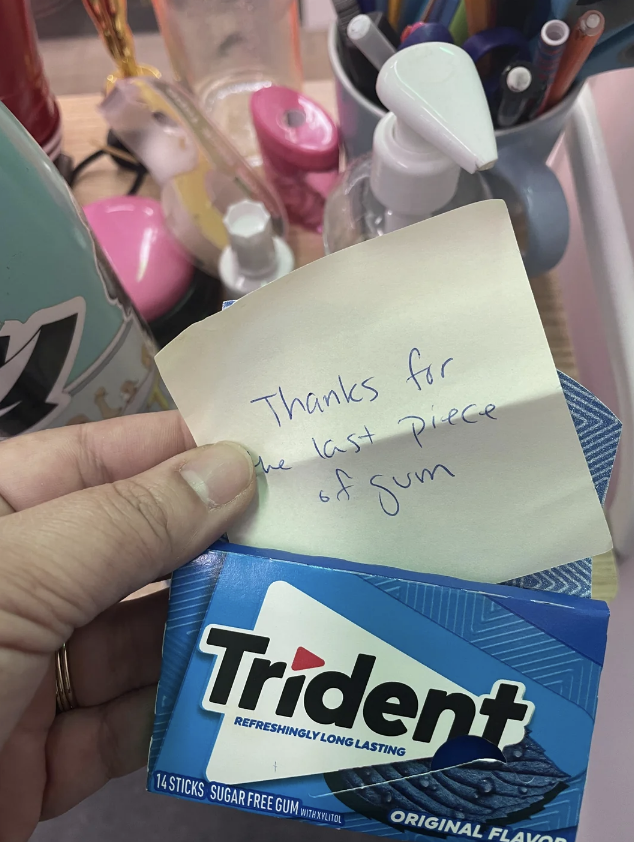 Note on pack of Trident gum with handwritten message &quot;Thanks for the last piece of gum&quot; surrounded by office supplies