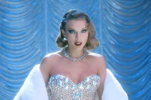 Taylor Swift wearing a sparkling strapless dress with a bejeweled necklace