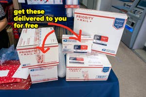 Assorted USPS Priority Mail boxes on a counter with text saying you can get them delivered to you for free