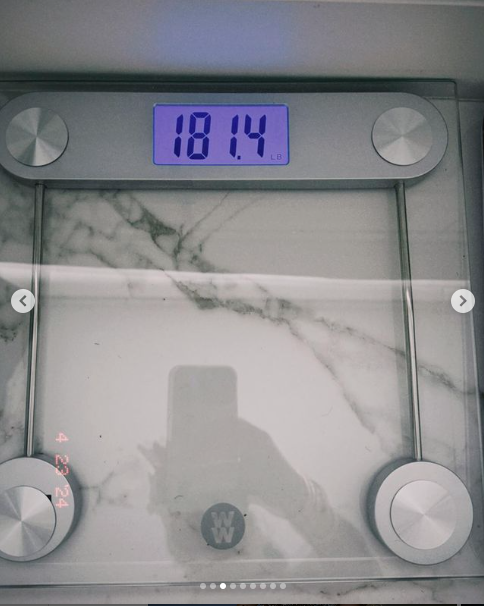Digital bathroom scale displaying a weight of 181.4 pounds