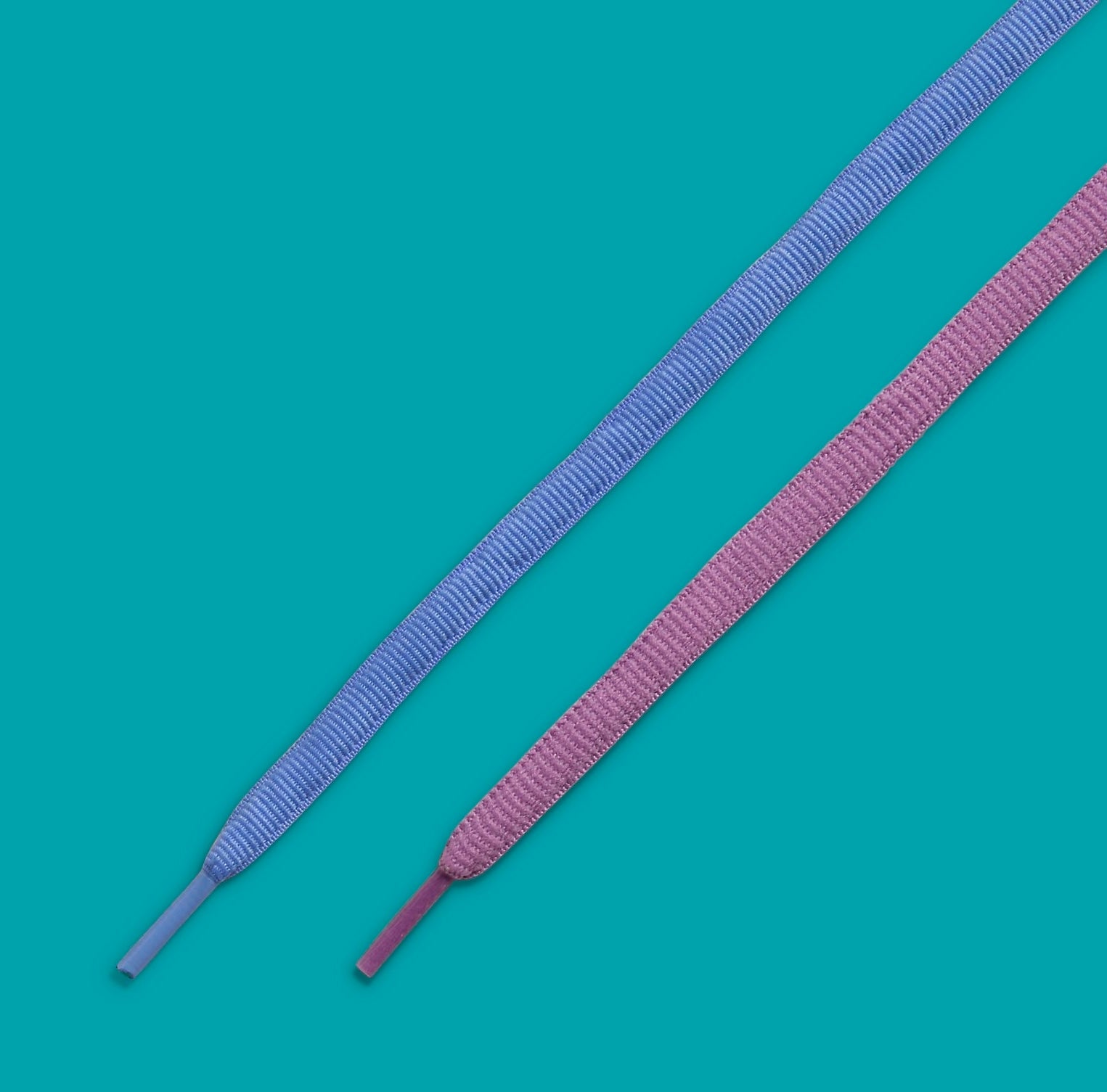 Two shoelaces against a teal background, related to sneaker fashion