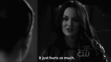 A woman expressing sadness with a subtitle saying, "It just hurts so much."