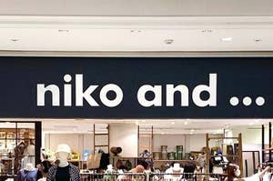 Storefront sign reading "niko and ..." with accessories visible in the shop behind