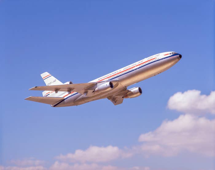 Airplane ascending against a blue sky, symbolizing travel and adventure