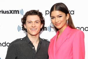 Tom Holland and Zendaya pose on the red carpet smiling