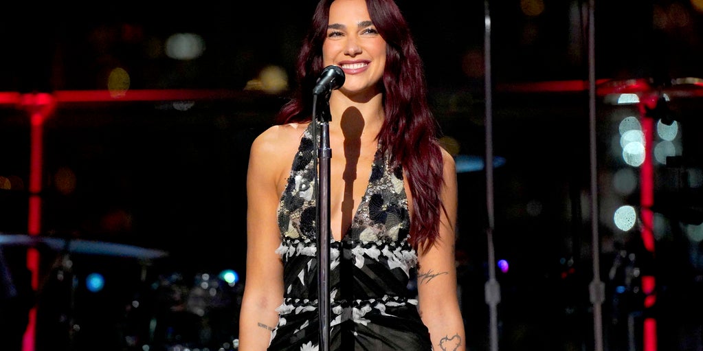 Dua Lipa Gets Surprised by Fan Who Got Junior M.A.F.I.A. "Get Money" Lyrics Tattooed at Her Suggestion - Vimarsana News
