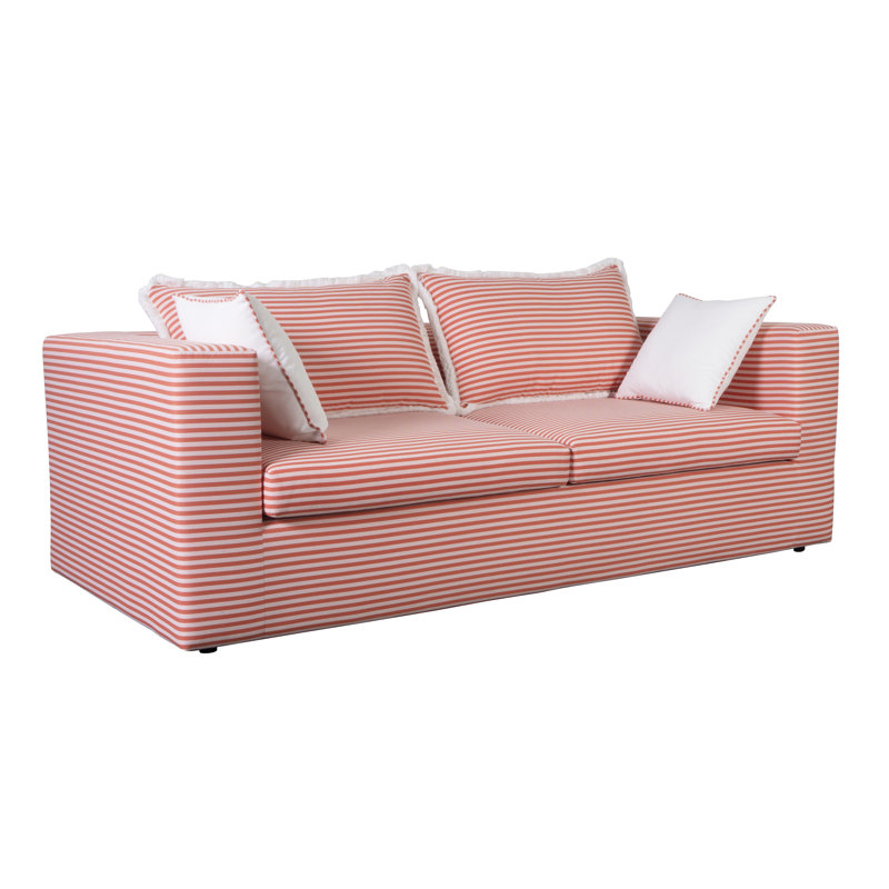 Striped sofa with cushions, suitable for a living room setting