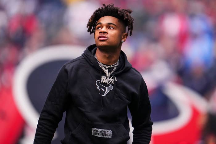 Tank Dell #3 of the Houston Texans looks on from the field prior to an NFL football game against the Tennessee Titans at NRG Stadium on December 31, 2023 in Houston, Texas.