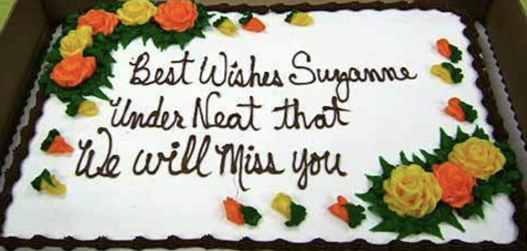 Cake with the message &quot;Best Wishes Suzanne Under Neat that We will Miss you&quot; indicating a misunderstanding for &quot;write that underneath.&quot;