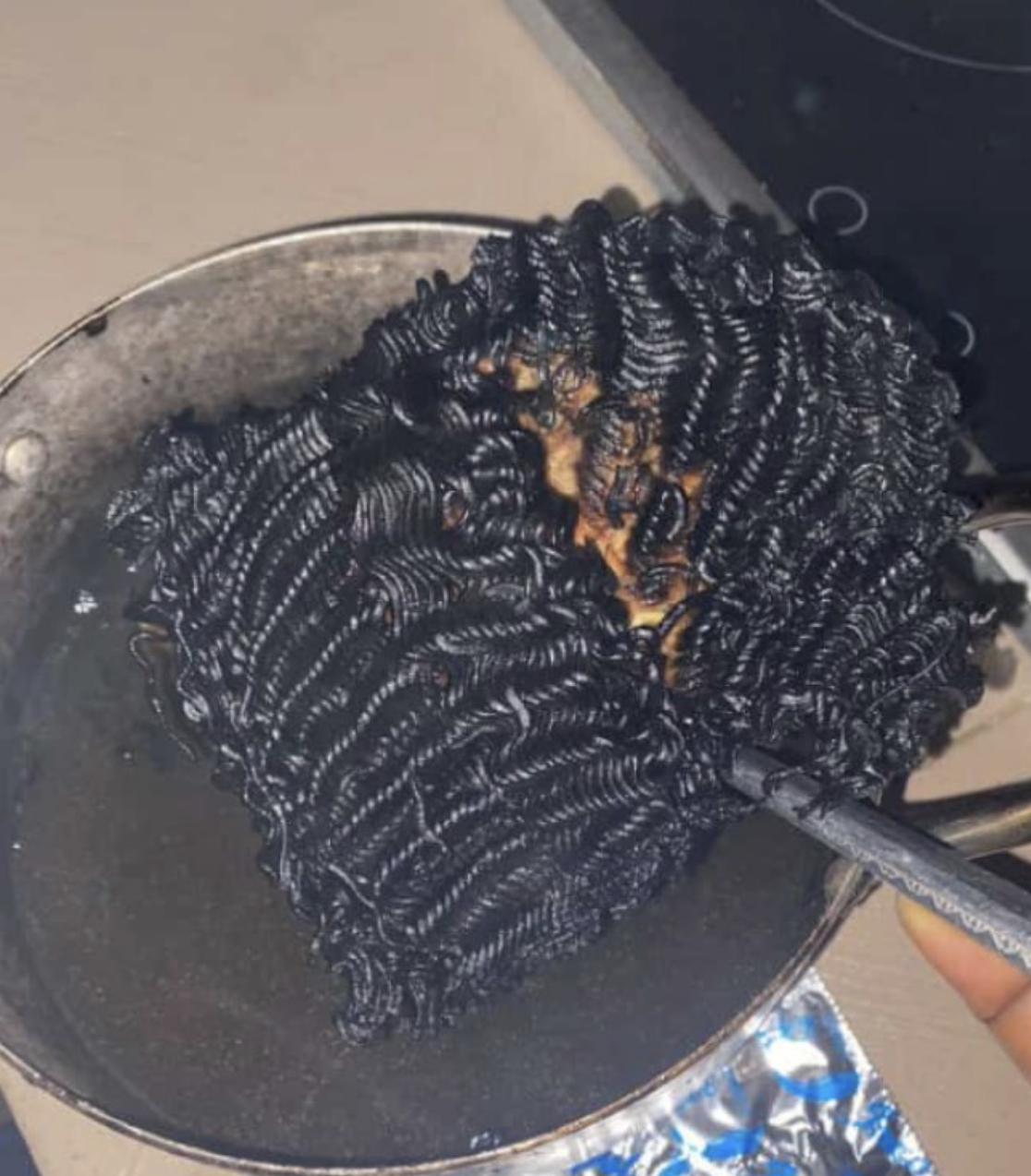 Burnt noodles in a pot