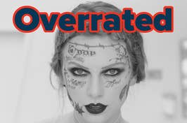 Person with face tattoos and makeup; word "Overrated" in large font above their head