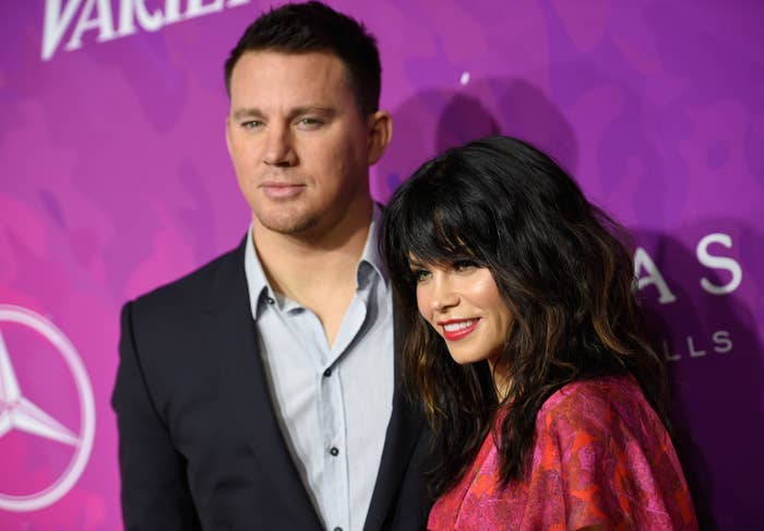 Channing Tatum and Jenna Dewan posing together; Dewan in a patterned dress, Tatum in a suit without a tie