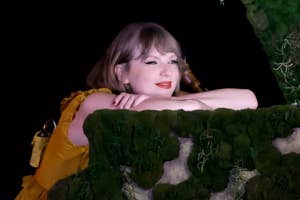 Taylor Swift leaning on a moss-covered balcony, wearing a yellow ruffled dress