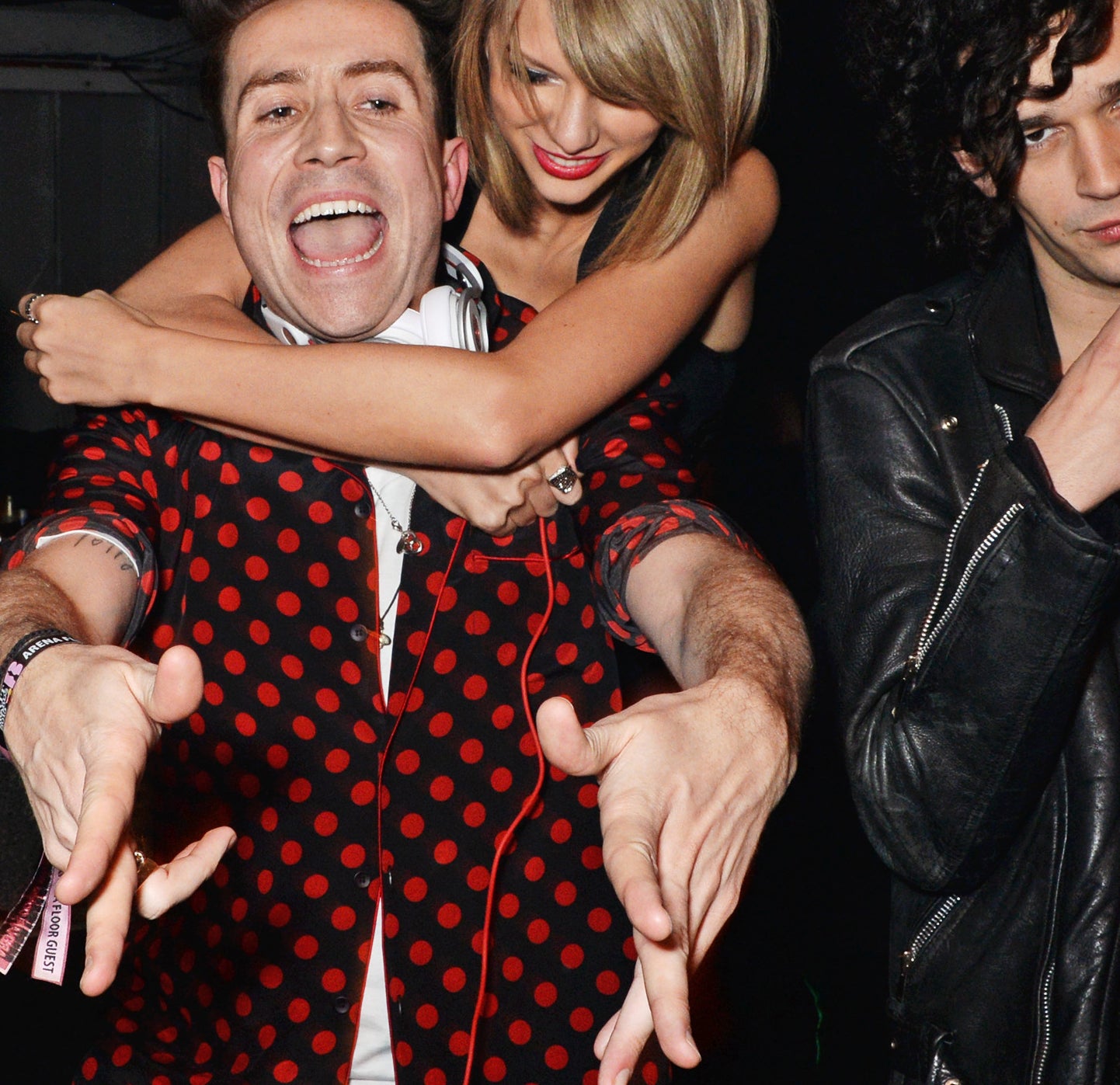 Taylor Swift and Matty Healy with British DJ Nick Grimshaw in 2015