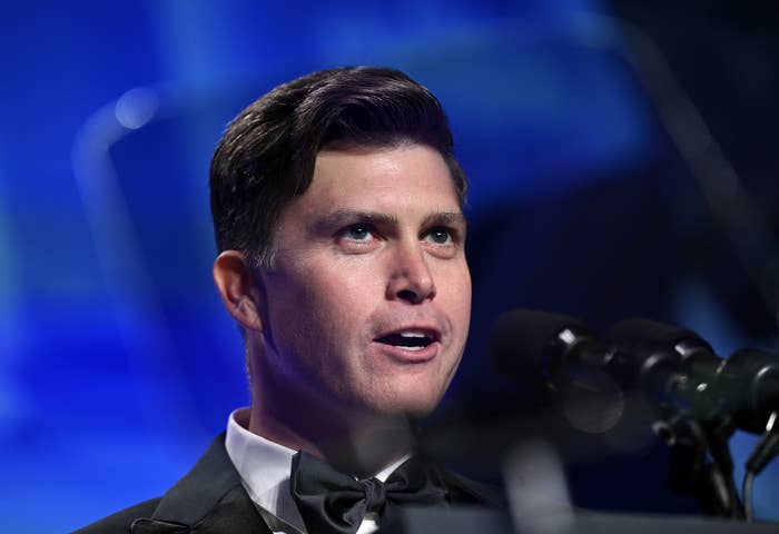 Closeup of Colin Jost speaking at a podium