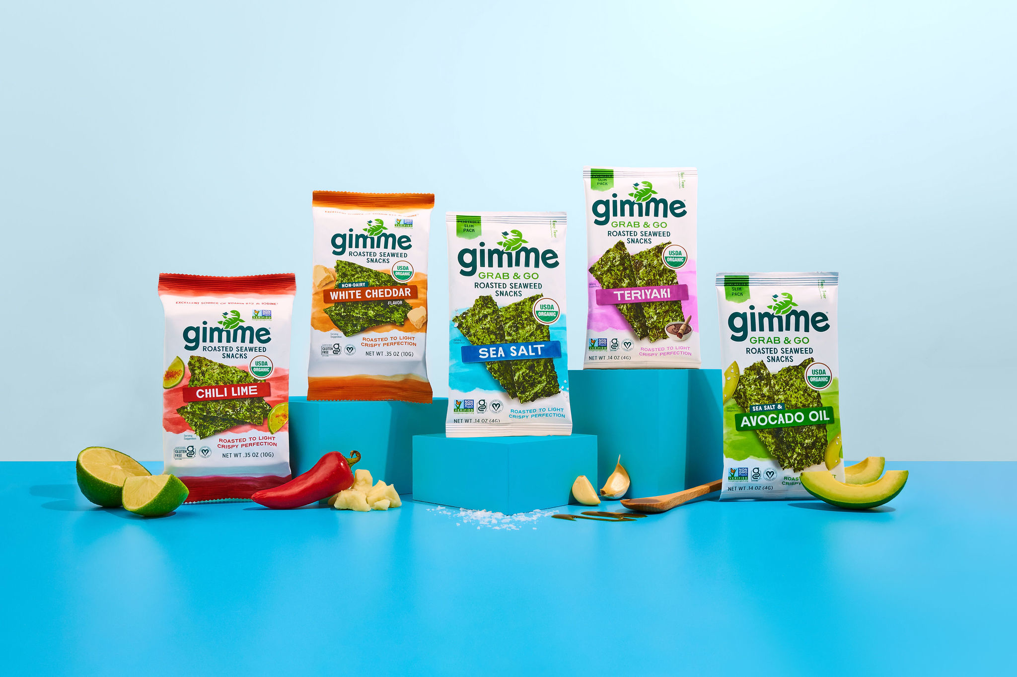 Assorted &quot;gimme&quot; seaweed snack packages displayed with ingredients like lime, avocado, and ginger