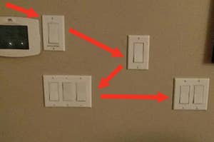 Five wall switches in various configurations with arrows pointing to them, suggesting confusion about their purpose
