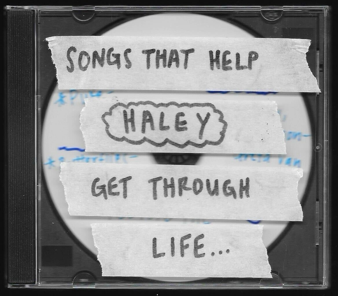 Image of a CD case with handwritten notes: &quot;SONGS THAT HELP HALEY GET THROUGH LIFE...&quot;