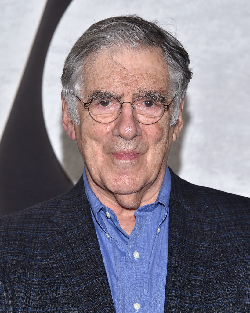Elliott Gould in a checkered blazer and blue shirt at an event