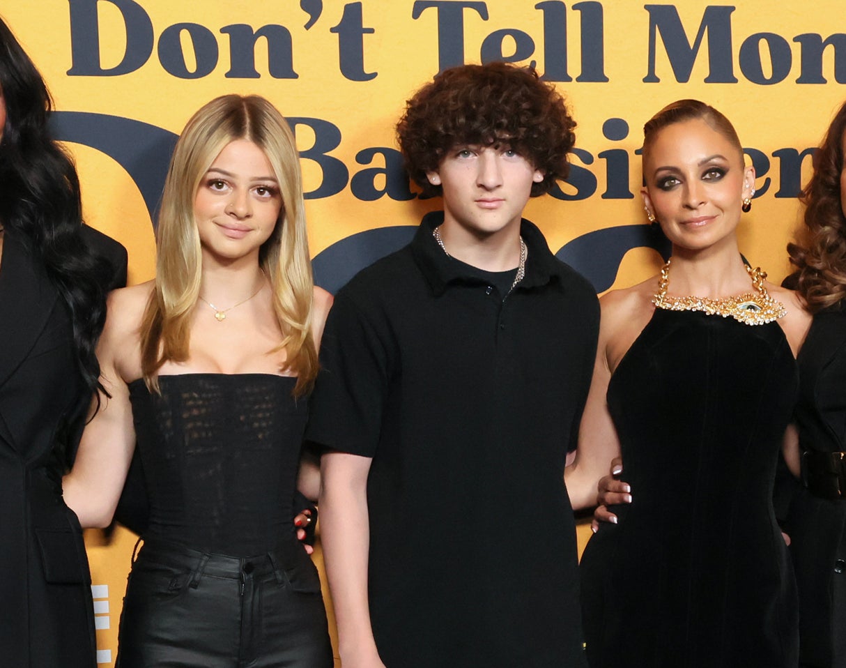 Group of seven people posing together at 'Don't Tell Mom the Babysitter's Dead' event