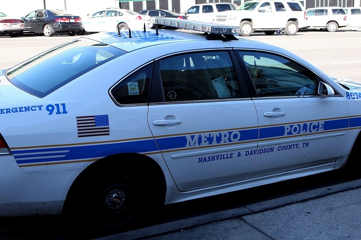 A parked Metro Police car with emergency 911 text, from Nashville/Davidson County