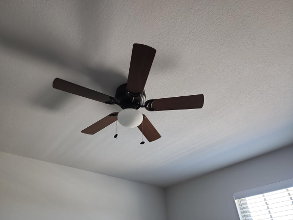 New ceiling fan installed in bright room