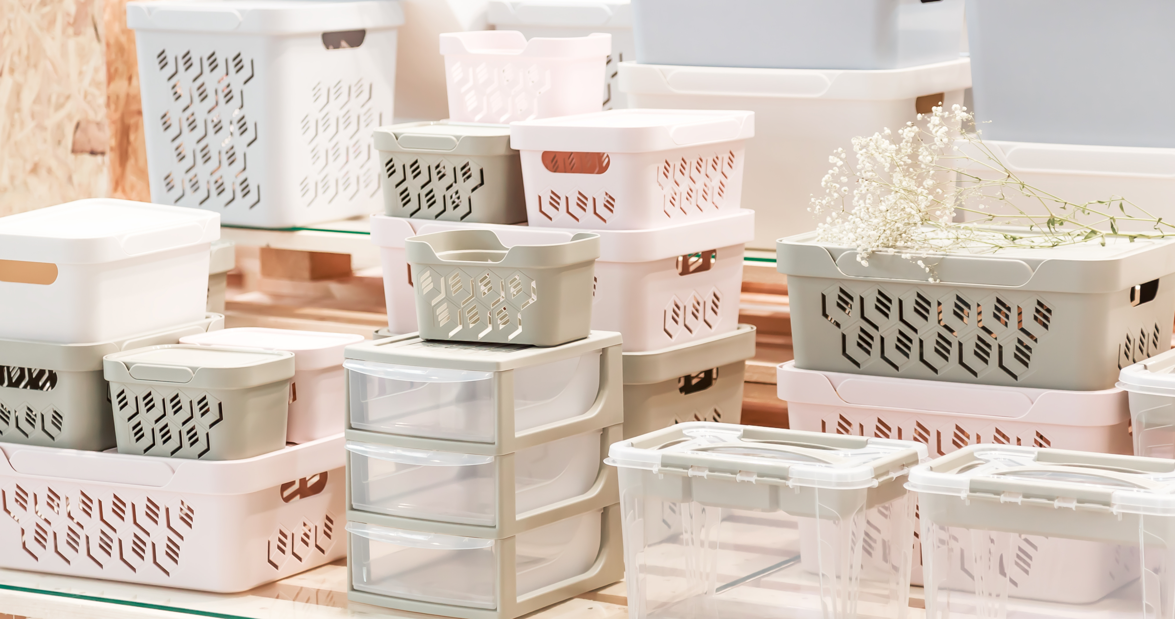 Assorted stackable storage bins and drawers in a home organization setup