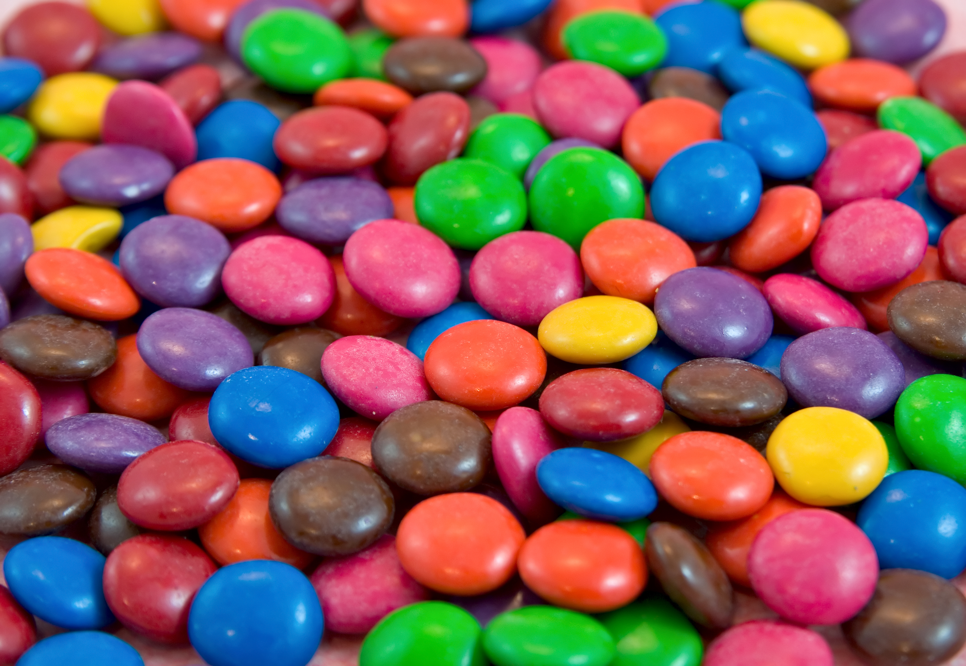 A close-up view of various colorful chocolate candies with candy shells