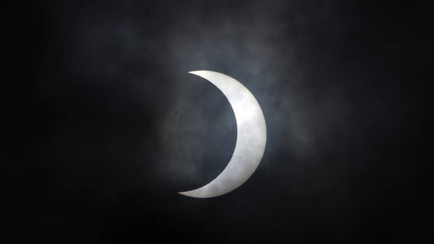 Partial solar eclipse against a dark sky