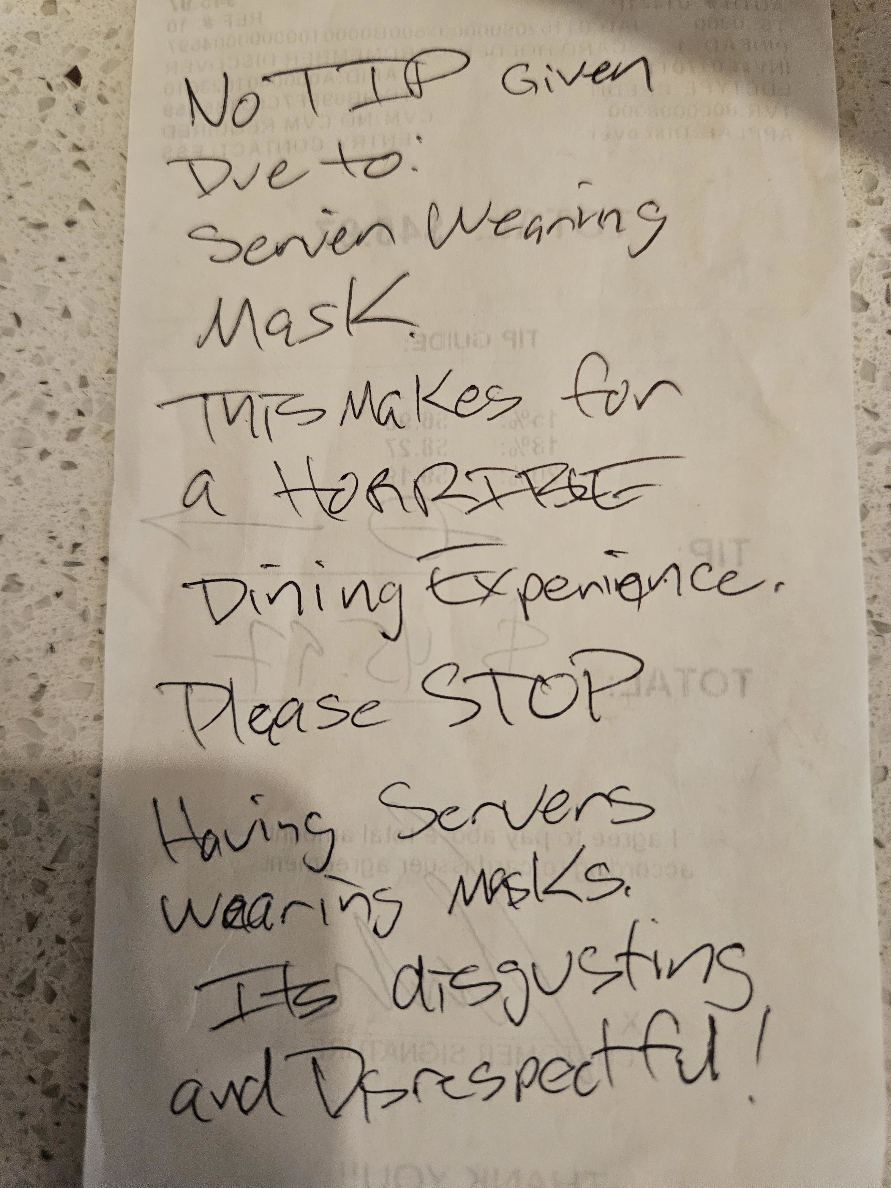 Receipt note criticizing service with no tip for masks, calls for stopping mask use, deems it disrespectful