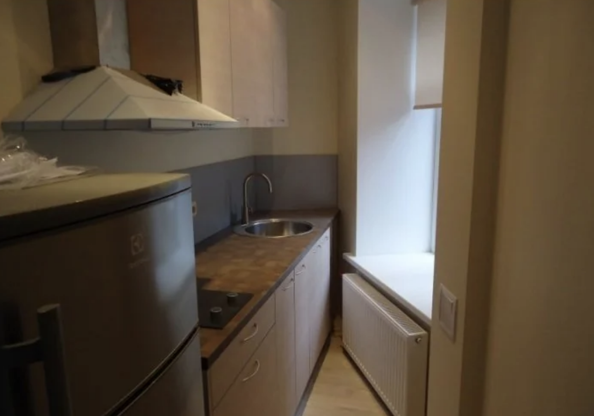 A very tiny, narrow kitchen