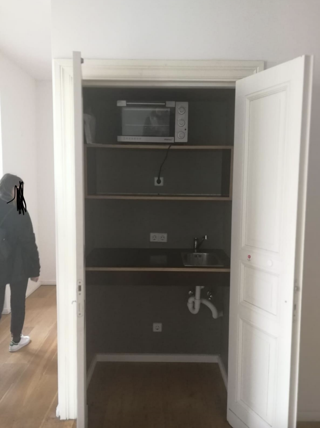 A kitchen in a closet
