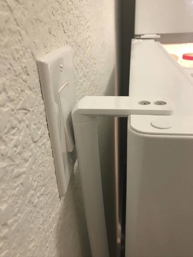 A fridge door hitting a light switch