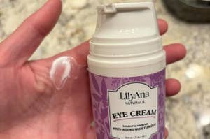 image of reviewer holding up the bottle of eye cream