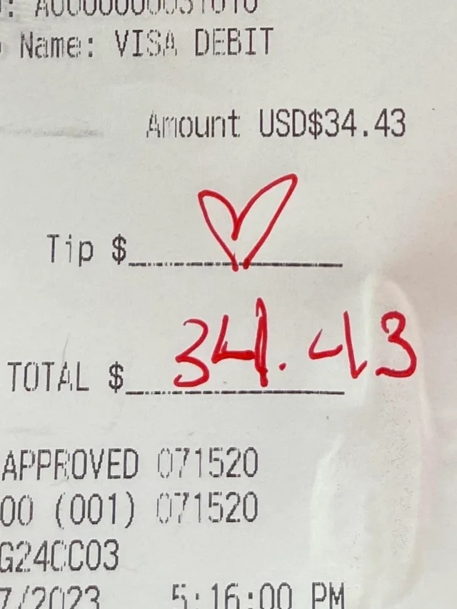 Receipt showing a total of $34.43 with a heart drawn instead of a written tip