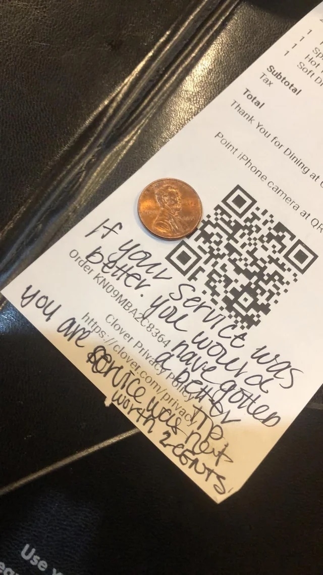 Restaurant receipt with handwritten tip advice and a QR code, accompanied by a penny