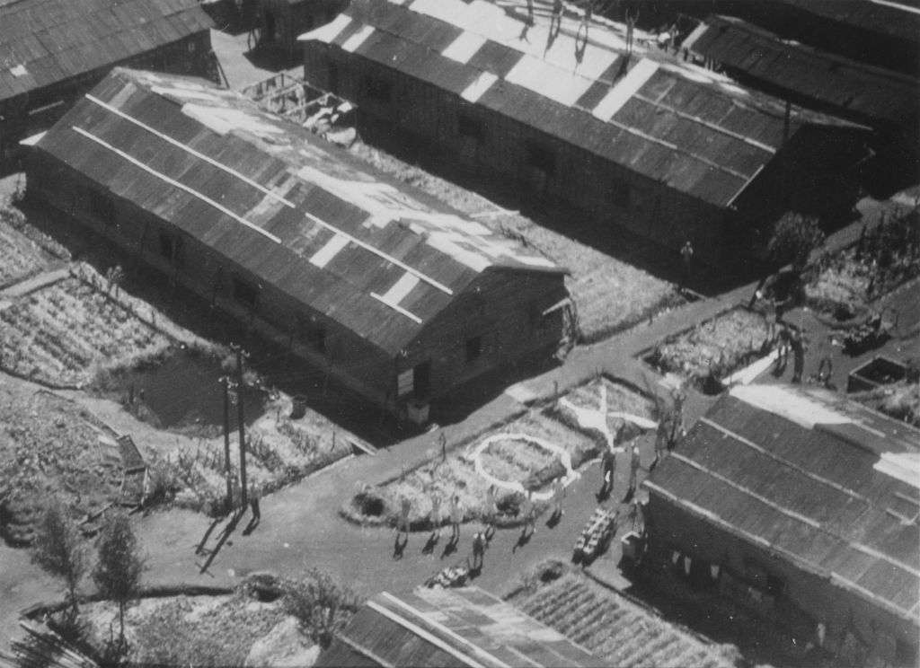 Aerial view of historical buildings with several individuals outside