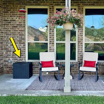 another reviewer's patio setup with deck box in the corner and yellow arrow pointing it out