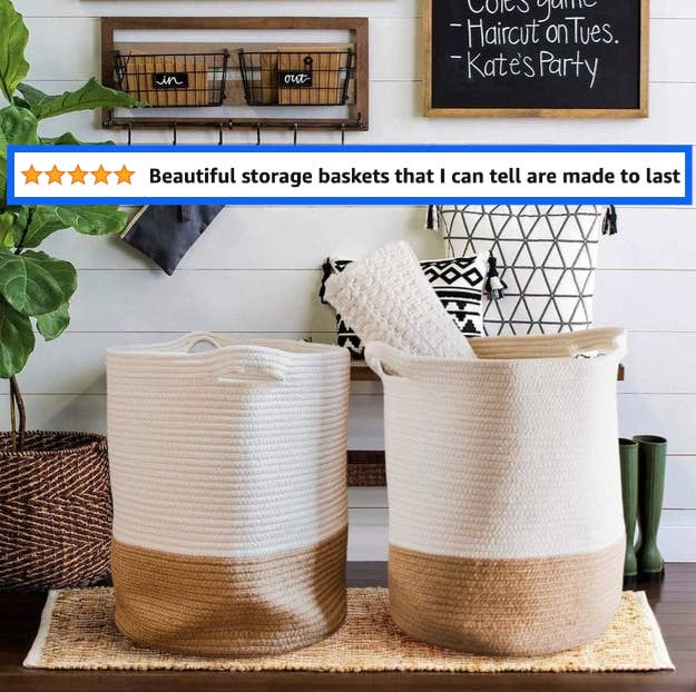 Two-tone woven baskets in a home organization setup with a wall planner and hooks in the background