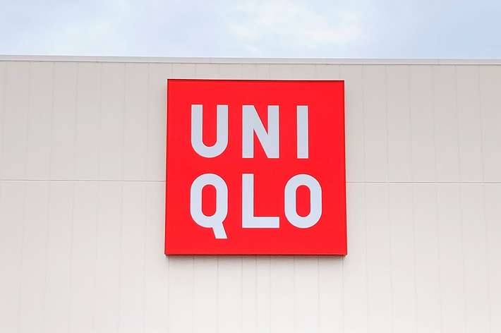 Storefront sign of UNIQLO on a building facade