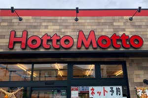 Storefront sign reading "Hotto Motto" above the entrance with Japanese text on windows