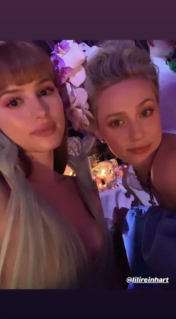 Madelaine and Lili pose for a selfie in formal gowns