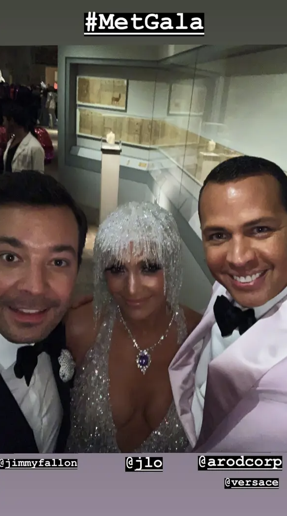 Selfie of Jimmy Fallon, Jennifer Lopez in sparkling outfit and headdress, and Alex Rodriguez at Met Gala