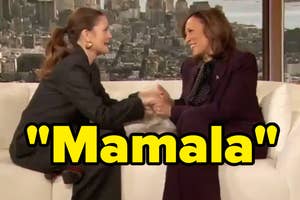 Two women shaking hands on a talk show, one seated and laughing with "Mamala" caption overlaid