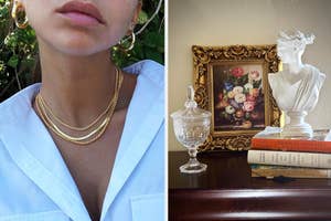 model wearing three layered gold necklaces and a bust beside elegant home decor and literature